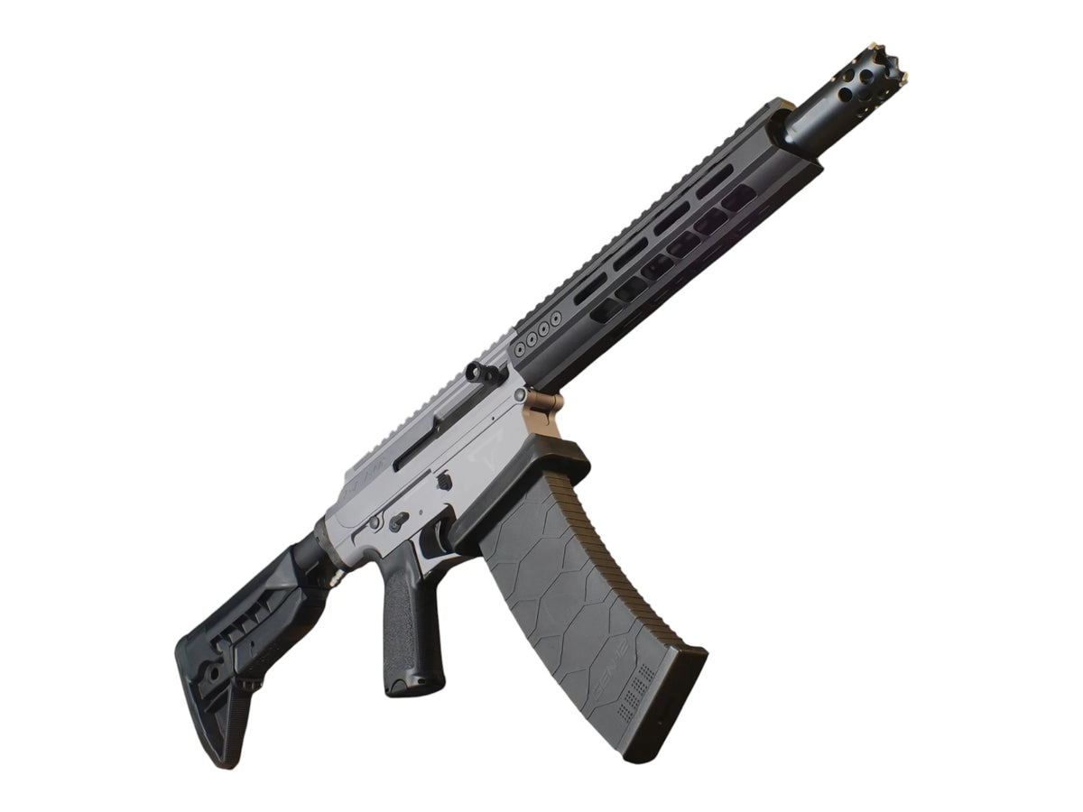 Complete Wolverine Gen-12 MTW shotgun in grey and tan fitted with the Invictus M-LOK rail and a magazine
