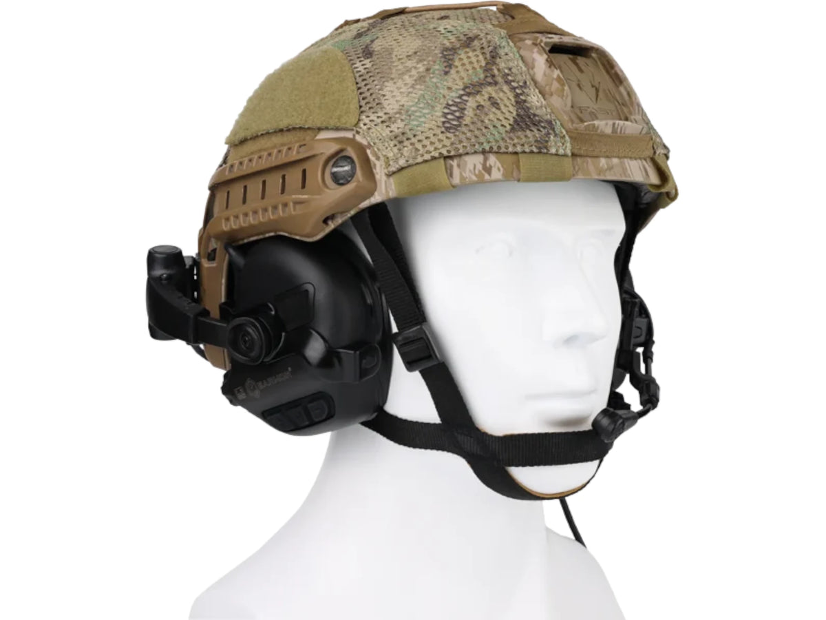 Front three-quarter view of a camo helmet with the M32X Plus headset mounted on both sides