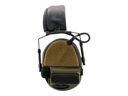 Earmor headset with a tan hook and loop panel fitted to a green ear cup, shown from the side