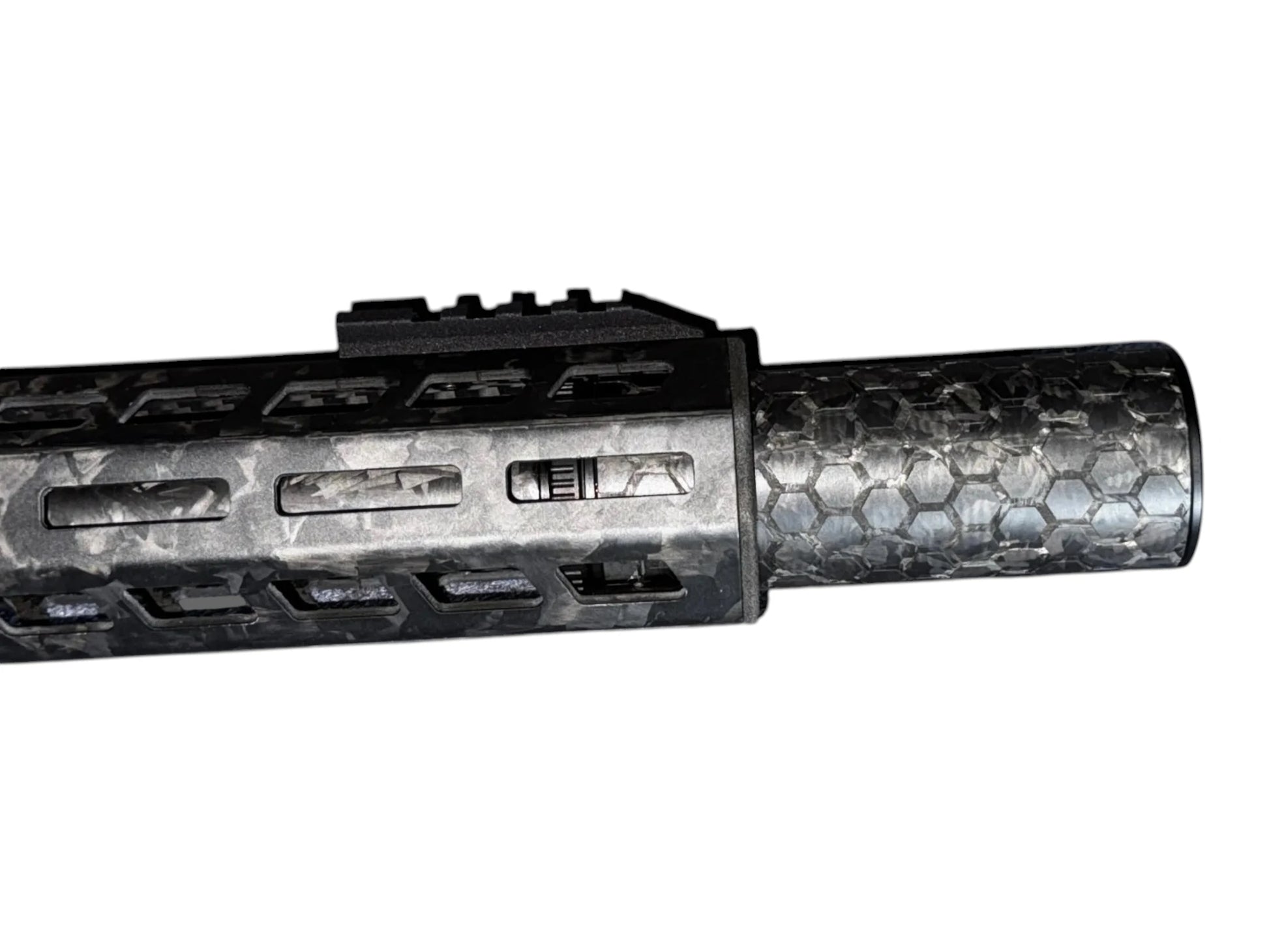 Image 2: Strike Carbon HEX 40 4 inch suppressor showing the laser-engraved hex pattern on the forged carbon body