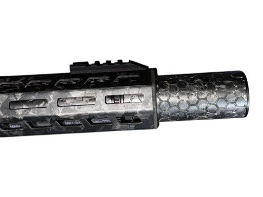 Image 2: Strike Carbon HEX 40 4 inch suppressor showing the laser-engraved hex pattern on the forged carbon body