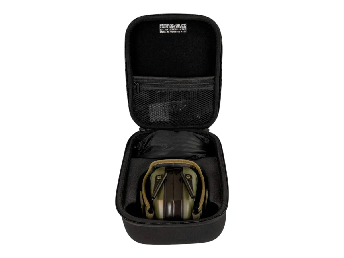 Wiley X hard carry case opened to show the Vapor Comm earmuffs stowed inside with a mesh lid pocket