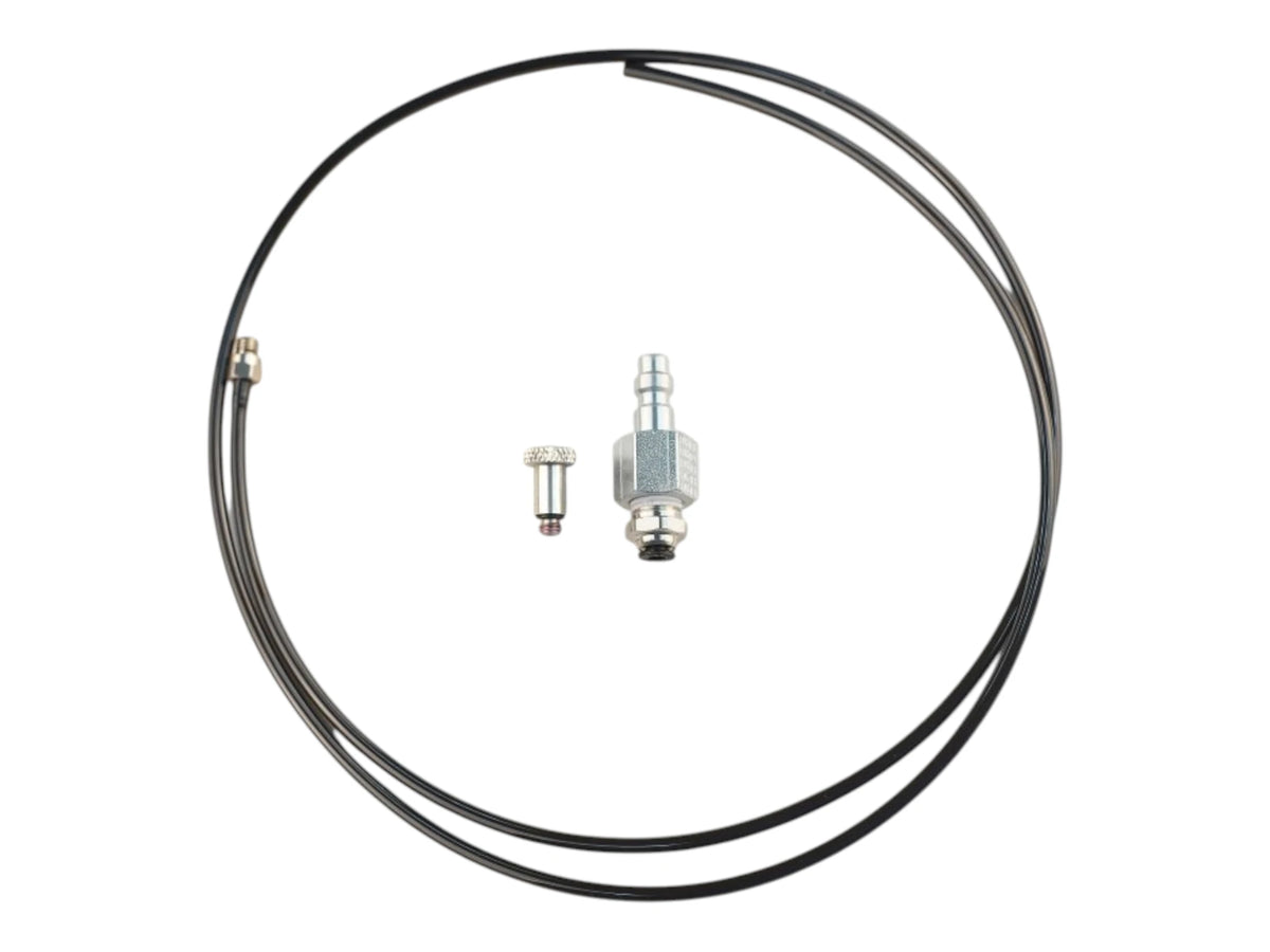 Wolverine BOLT airline kit: a coil of black airline with a quick-disconnect fitting and a small barbed fitting laid alongside