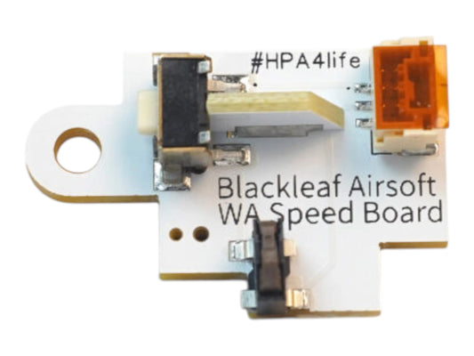 Angled view of the white Wolverine Blackleaf V2 speed trigger board with its orange connector and microswitches