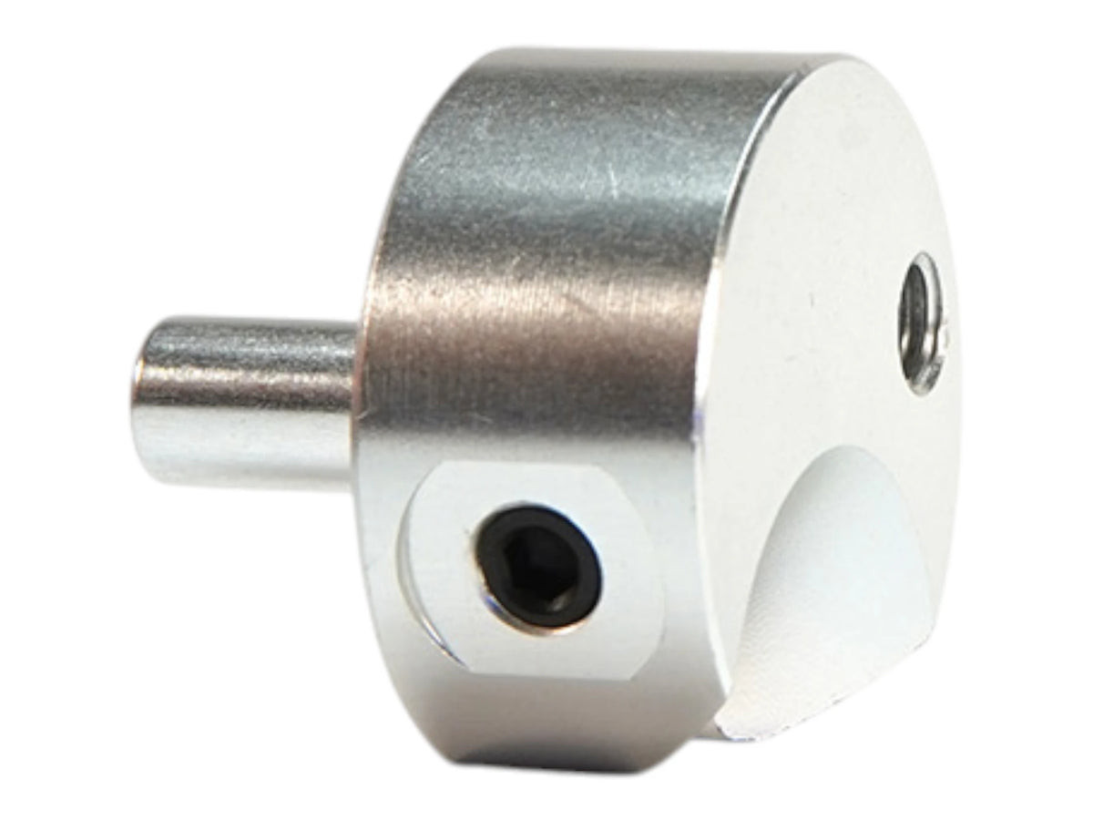 Wolverine hard point adapter viewed from the port face, showing two openings in the flat machined face and the side tube stub